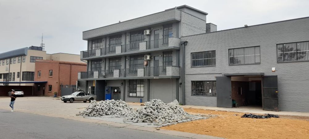 Refurbished commercial shop and warehouse with new paving